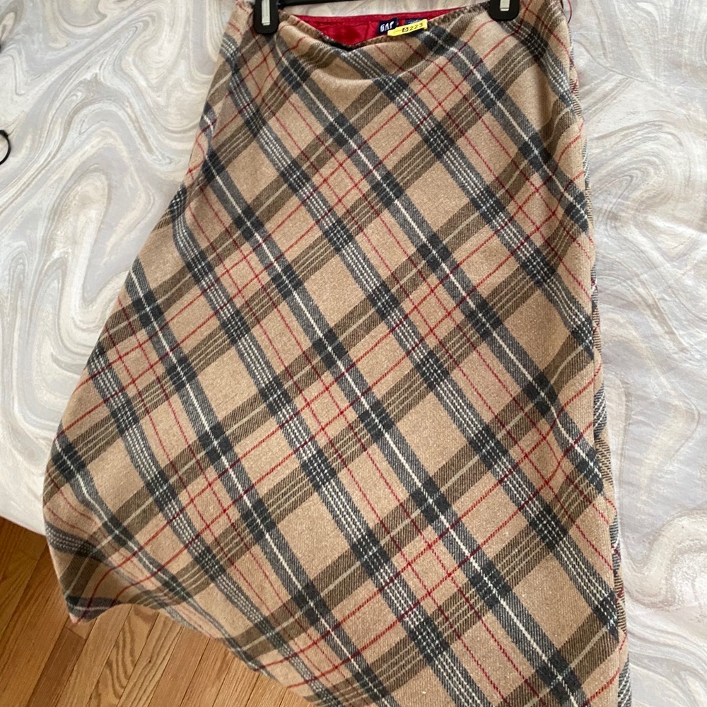 Plaid, wool skirt. Hits below knee.